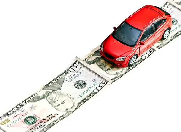 Red toy car on the money road, isolated on white — Stock Photo, Image