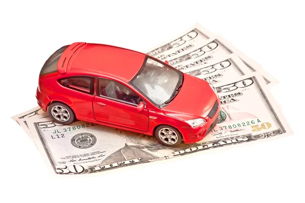 Carro de brinquedo e dinheiro sobre branco. Conceito de carro de aluguel, compra ou seguro — Fotografia de Stock