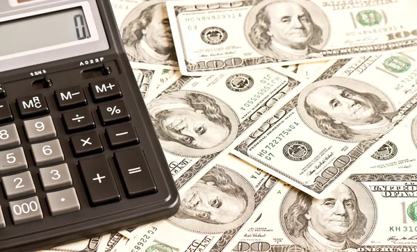 Business picture: money and calculator over white — Stock Photo, Image