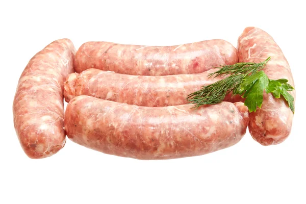 Raw meat sausages with greens isolated on white background — Stock Photo, Image