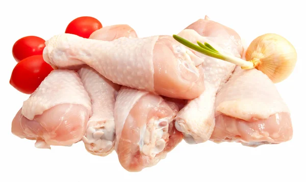 Raw chicken legs with vegetables, isolated on white background — Stock Photo, Image