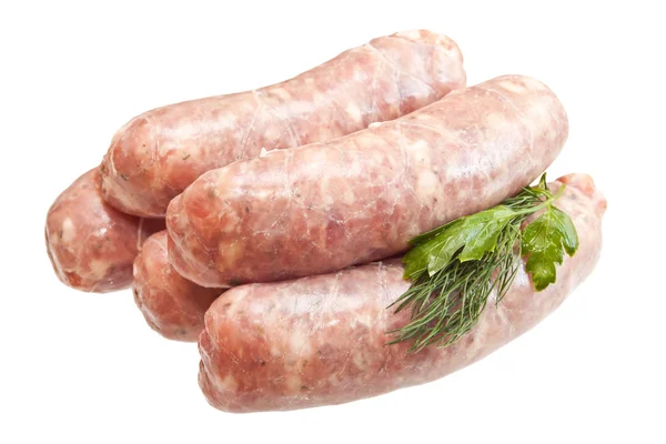 Raw meat sausages with greens isolated on white background — Stock Photo, Image