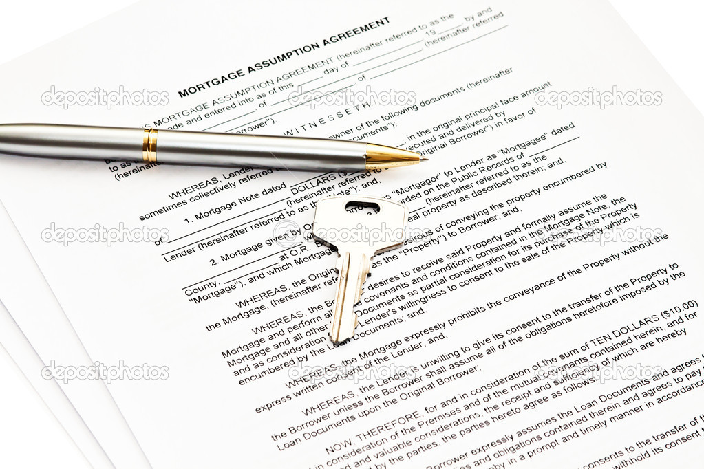 Mortgage assumption agreement with a pen for signature and a key