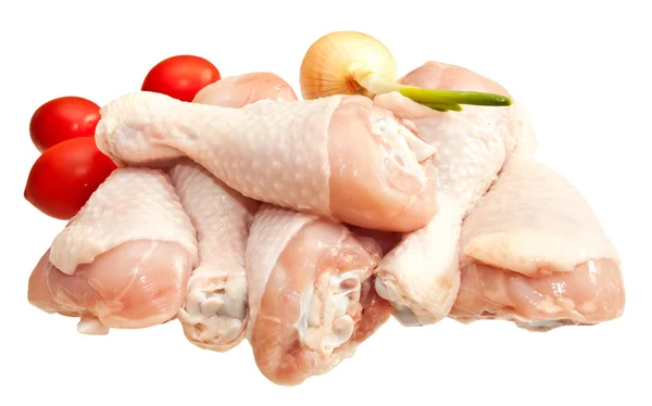 Raw chicken legs with vegetables, isolated on white background — Stock Photo, Image