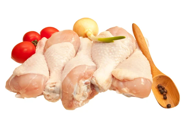 Raw chicken legs with vegetables, isolated on white background — Stock Photo, Image