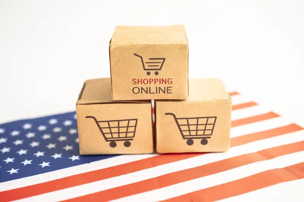 Box with shopping online cart logo and USA America flag, Import Export Shopping online or commerce finance delivery service store product shipping, trade, supplier concept.