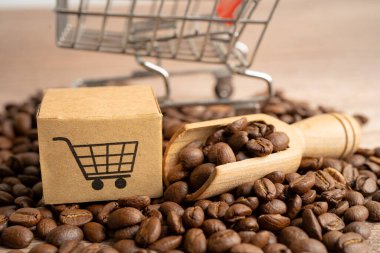Kahve çekirdekleri üzerinde alışveriş arabası logosu olan bir kutu, çevrimiçi ithalat ihracat alışverişi ya da eCommerce dağıtım mağazası ürün taşımacılığı, ticaret, tedarikçi konsepti.