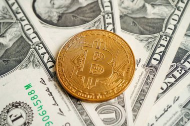 Golden bitcoin on US dollar banknotes money for business and commercial, Digital currency, Virtual cryptocurrency, blockchain technology.