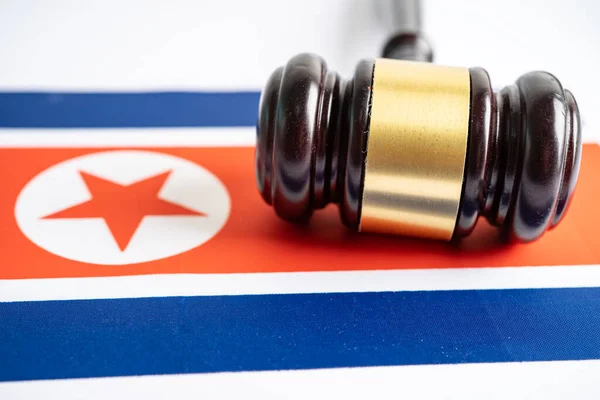 North Korea flag with gavel for judge lawyer. Law and justice court concept.