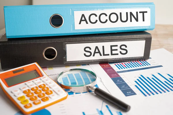 Account and Sales. Binder data finance report business with graph analysis in office.