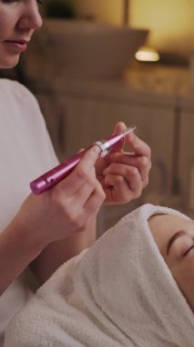 Close-up portrait of a womans face receiving facial lifting procedure. Skin care. Medical treatment. Healthy perfect clean skin. Facial treatment.