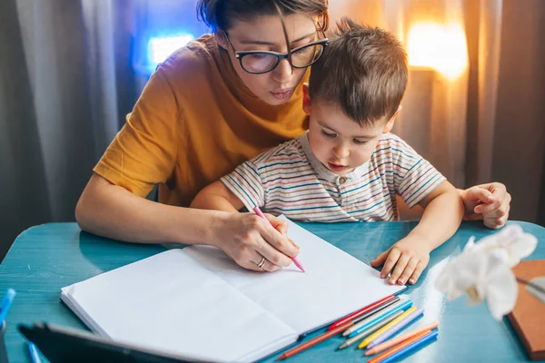 Schoolboy Doing Homework Home Mom Blue Wooden Table Pandemic Lockdown —  Fotos de Stock