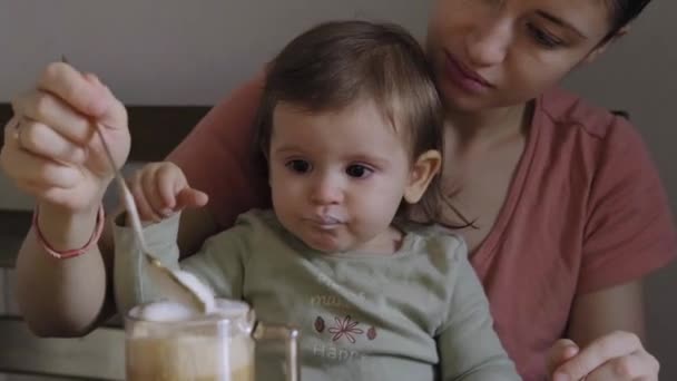 Mom Feeding Her Baby Daughter Home Yogurt Spoon Baby Care — Αρχείο Βίντεο