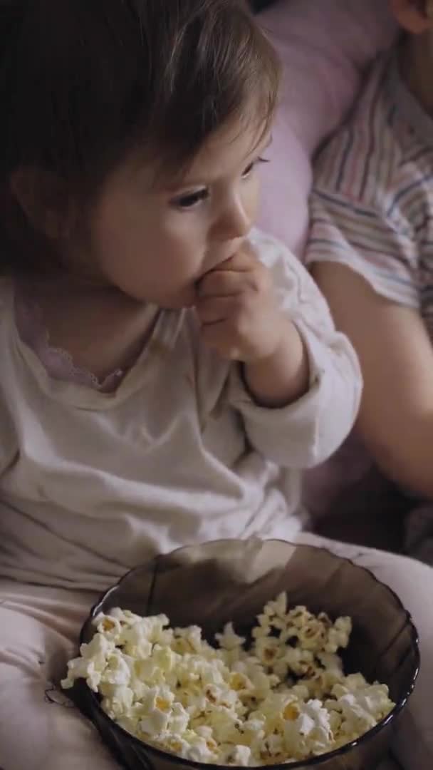 Baby Girl Taking Popcorn Bowl While Watching Movie Portrait Baby — 图库视频影像