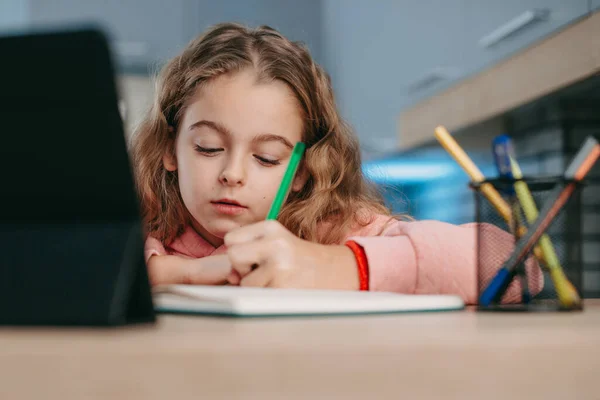 Schoolgirl Watching Online Course Tablet Kitchen Taking Notes Doing Homework — Φωτογραφία Αρχείου