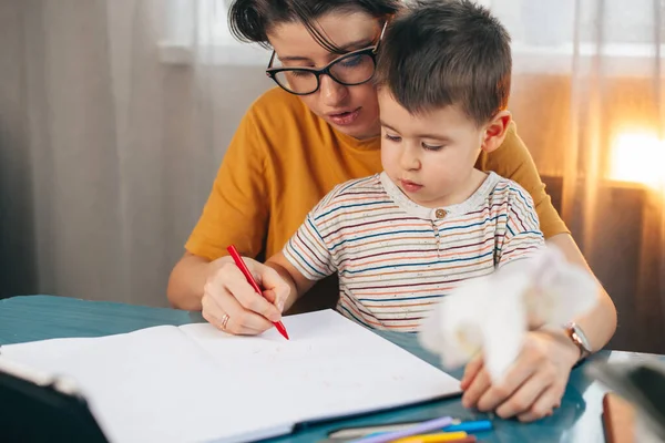 Mother Teaching Her Small Son Write While Sitting Table Business —  Fotos de Stock