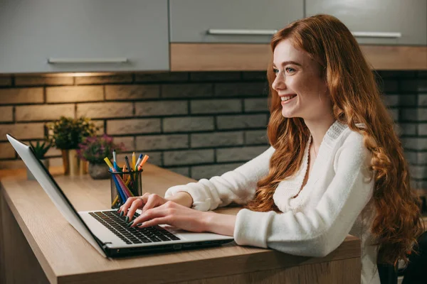 Side View Ginger Woman Typing Laptop While Sitting Desk Home — Stok fotoğraf