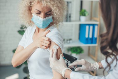 Portrait doctors hands holding syringe making covid 19 vaccination in patients arm. Coronavirus vaccination. Medicine medical health. Hand virus. Pandemic