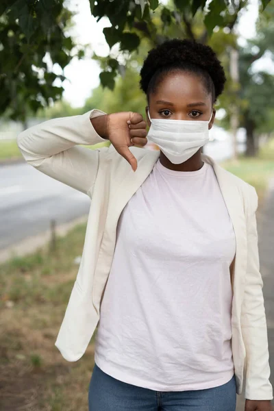 African American Woman Wearing Medical Mask Showing Dislike Sign Thumb — Stok Foto