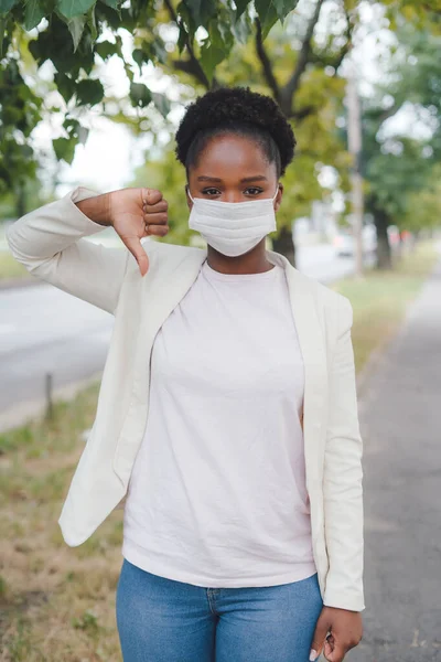 Stressed African American Businesswoman Medical Mask Giving Thumbs Showing Dislike — Stok Foto