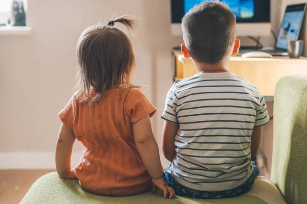 Back View Brother His Baby Sister Watching Television Together Living — 图库照片