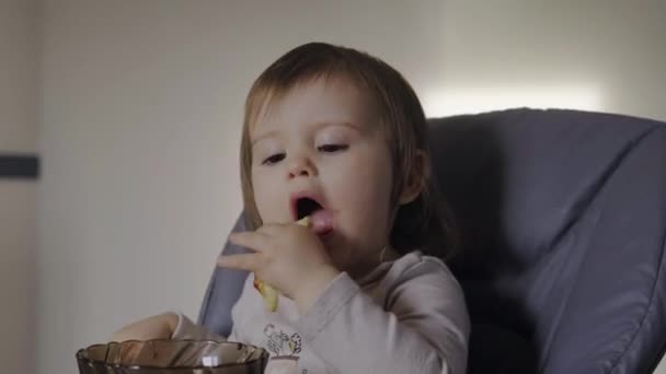 Baby Girl Having Breakfast Her Baby Seat Holding Cake Dessert — Vídeo de Stock