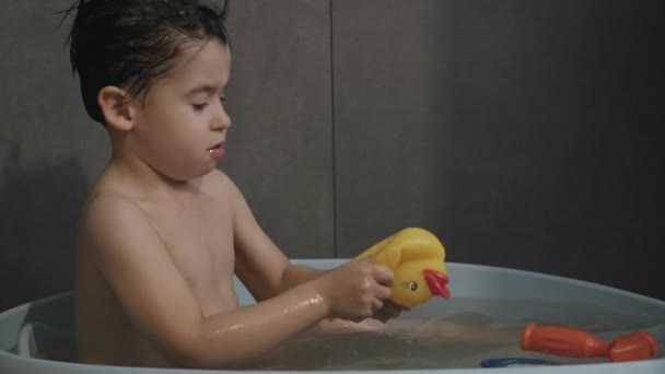 Boy Playing Yellow Rubber Duck Toy While Taking Bath Bathing — Video