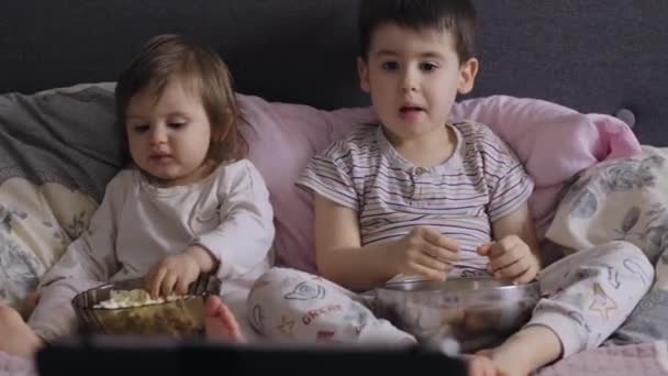 Front View Two Little Children Eating Popcorn Big Bowl While — Video