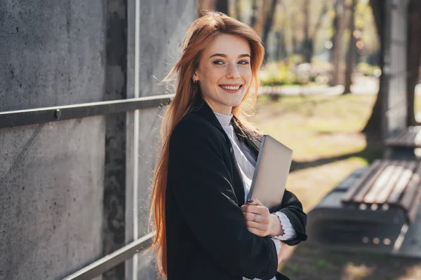 Smiling Redheaded Woman Carrying Laptop Posing Outdoor Park Holding Modern — Zdjęcie stockowe