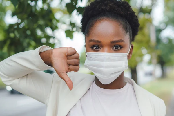 Portrait African American Woman Wearing Medical Mask Showing Dislike Sign — Stok Foto