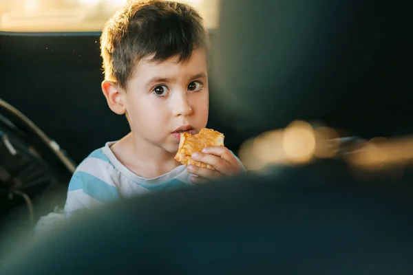 Portrait Boy Sitting Car Eating Piece Meat Pie Road Trip — Fotografia de Stock