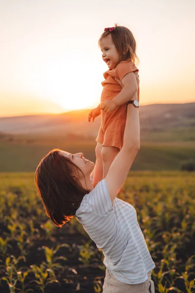 Mom Lifted Her Daughter Holding Her Arms Looking Lovingly Child — Photo