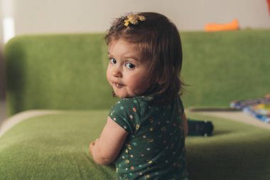 Closeup portrait of a beautiful cute babys expression at home. Happy family, childhood. Beauty face. Closeup portrait.