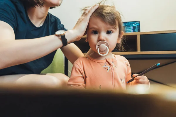 Mother Trying Braid Her Babys Hair Sucking Pacifier Looking Focused — Fotografia de Stock