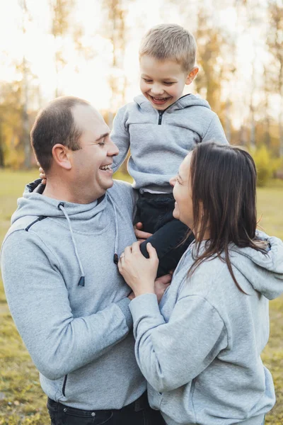 Happy Caucasian Family Hugging While Posing Together Active Kid Playing — ストック写真