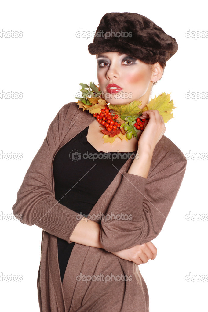 Portrait of beautiful girl with autumn leaves