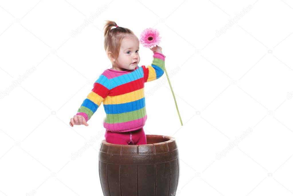 Beautiful little girl in the flower pot