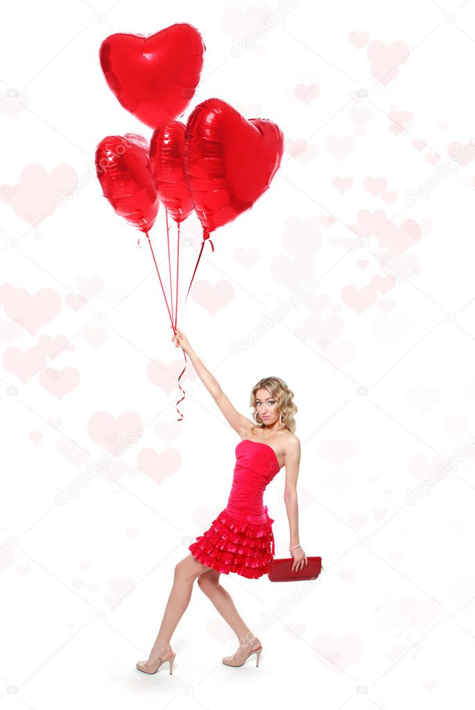 beautiful young woman with a heart-shaped balloons