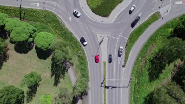 Aerial view of the street, roundabout, and pedestrian bridge over the crossroad in Finland
