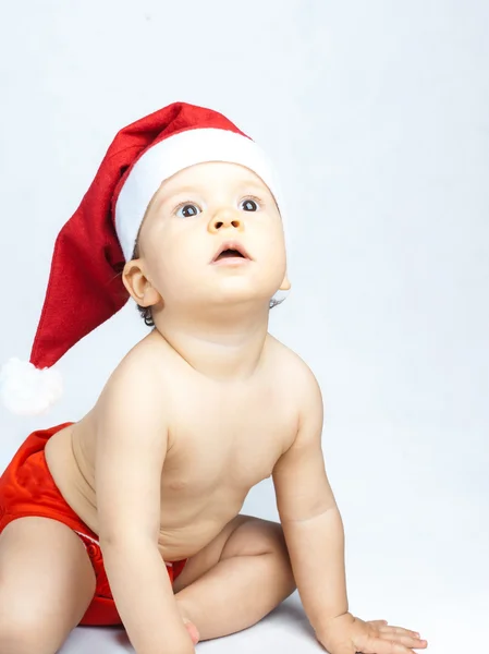 Bebê usando chapéu de Papai Noel Fotos De Bancos De Imagens