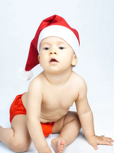 Bebê usando chapéu de Papai Noel Imagens De Bancos De Imagens