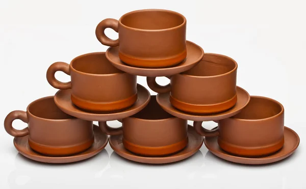 Tasses à thé et soucoupes sur fond blanc — Photo