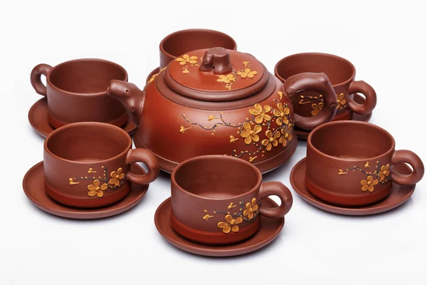 Tazas de té y platillos sobre un fondo blanco —  Fotos de Stock