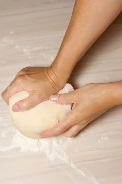 Hands kneading a dough — Stock Photo, Image