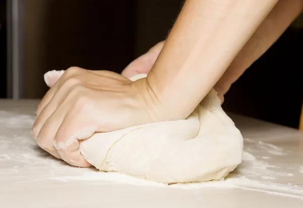 Hands kneading a dough — Stock Photo, Image