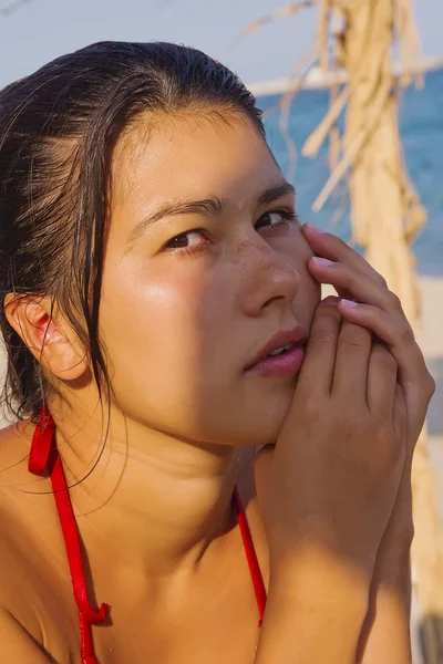 Portrait of the Asian woman on a beach — Stok fotoğraf