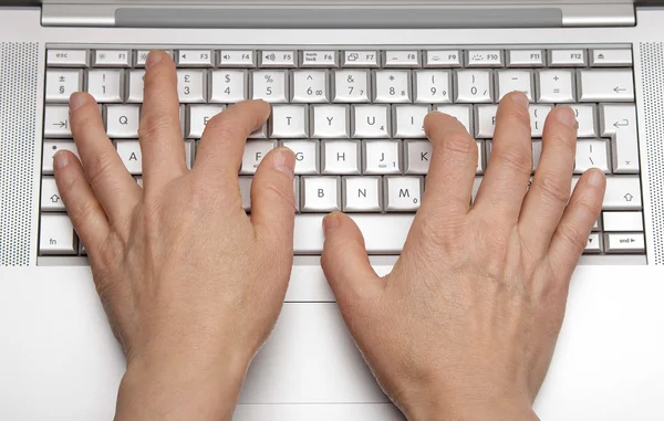 Female hands printing on the keypad a laptop — Stock Photo, Image