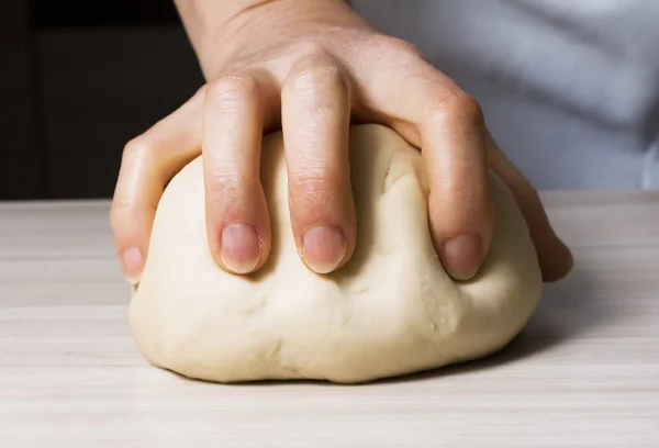 Hands kneading a dough. — Stock Photo, Image