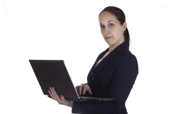 Business woman working on a laptop computer — Stock Photo, Image