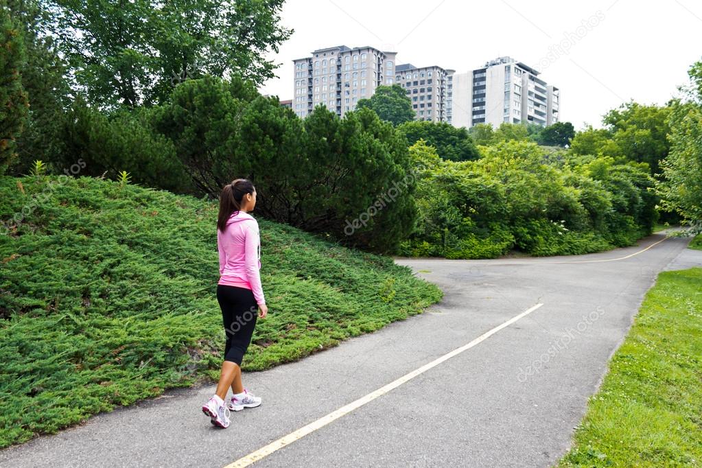 Woman walking on the jogging path